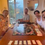 Augustus Prew Instagram - Playing Gay Monopoly on Fire Island with some of my chosen family is truly what life is all about and exactly what nature intended. Thank you Weather Queen for honoring our games night with a dramatic storm, it added the chicest snuggliest backdrop to our games night. Love ya girl. Quick bit of history- Gay Monopoly was an unofficial tongue in cheek version of monopoly developed by “The Parker Sisters”- truly some of the wittiest writers of all time (see “You were caught eating quiche”card) in 1983 to raise money to fund AIDS research which at the time was already devastating the gay community and which very little was being done to prevent by the (straight) powers that be (google Larry Kramer/Eric Sawyer/Anthony Fauci). You could buy it in stores and everything until Parker Brothers (owners of the actual monopoly game) sued them for copyright infringement because a)they are homophobic capitalists (ironic also given that the game was initially created to warn against capitalism) and b) they are boring (see Straight City photo to understand that reference). It’s now a really rare gem of a game so if you have/find one, look after it with all your heart and keep it close because it has immense historic significance. My favorite part of the game is the “Do you know your queer history?” card, where if you land on it have to answer a question about influential queer people throughout history- I learned about George Washington Carver, HansChristian Andersen and Benjamin Britten and was reminded of the passage in the Bible that tells us that King David loved his boyfriend Jonathan “surpassing the love of a woman” in the book of Samuel. Yes that’s actually in the Bible so you can keep that one for your next holiday season. Oh and the Benjamin Britten was gay. Didn’t know that either. Playing it amongst the ghosts of Fire Island (many many many queer people died of AIDS here- most had nowhere else to go) and a mere block from the house of Patient Zero (the first known person to be infected by the HIV virus) was profound to say the least. I love y’all. Look after after each other. Queer people are so powerful. We always have been and we always will be 😘🌈❤️ Fire Island Pines