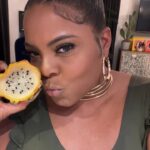 Brely Evans Instagram - Just checking in on yall! Slanging dragon fruit. @jameelajahari_ TURNT NECKLACE and The BRELY Body Jumpsuit in Green!!! #inuniform #waterwalkers #fashion LINK IN MY BIO! Worldwide