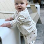 Brittany Daniel Instagram - Our little chubby cheeks is 11 months old. Also dying over this splatter paint sweatsuit by @ryleeandcru 😍