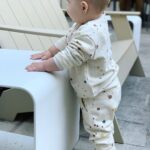 Brittany Daniel Instagram - Our little chubby cheeks is 11 months old. Also dying over this splatter paint sweatsuit by @ryleeandcru 😍
