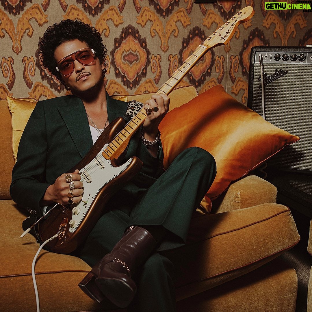 Bruno Mars Instagram - The @BrunoMars Stratocaster is a true treasure. Crafted from resonant ash, this limited edition guitar features sculpted American Ultra body contours for unmatched comfort and seamless access to high notes. The Mars Mocha Heirloom nitrocellulose lacquer finish not only gives it an aged charm, but also enhances resonance and tone. Head to the link in bio to learn more.