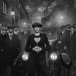 Cara Delevingne Instagram - By Order of the Peaky Blinders This photograph is an unapologetic nod to Steven Knight’s hugely popular 1920s British gangster series Peaky Blinders. With satanic chimneys belching smoke and cobbles awash with industrial grime, the period drama brought hellish industrial UK into our living rooms but did it with an admirable swagger and aesthetic genius. The anomaly of Peaky Blinders is that cinematography made hell look attractive.   Audiences around the world found themselves engaged by a new street subculture and sympathising with men with totally disposable moral fibre. Birmingham in the UK became known around the world for what it was portrayed to be like 100 years ago rather than what it is like now. That’s quite a trick.   My creative leaning was to twist the narrative a little. Cillian Murphy owned every scene in the series with a mesmerising intensity, but what if the leader of the gang was a woman? Most of the women in the series were depicted either as objects of lust or familial loyalty rather than necessarily agents of their own destiny. They faded into the scenery as often happens in mobster shows.   In my mindset there was only girl to go this job - the irrepressible force of nature that is Cara Delevingne. She owns this scene, just as Cillian did in the series, and that says it all. She is a national treasure and we are lucky to work with her as often as we do. As I often say to those that ask, “It’s her eyes”.   There was a big cast that day and everyone played their role. It only takes one person to kill the vibe and that evening everyone did a grand Peaky Blinders job. Maybe some of my extras have missed their vocation in life. Thank you to our friends at @maddoxgallery for their help with putting this production on. We look forward to unveiling this image, alongside others from this shoot, at Maddox Gallery’s new space in Berkeley Street when our solo show starts on the 27th of October.
