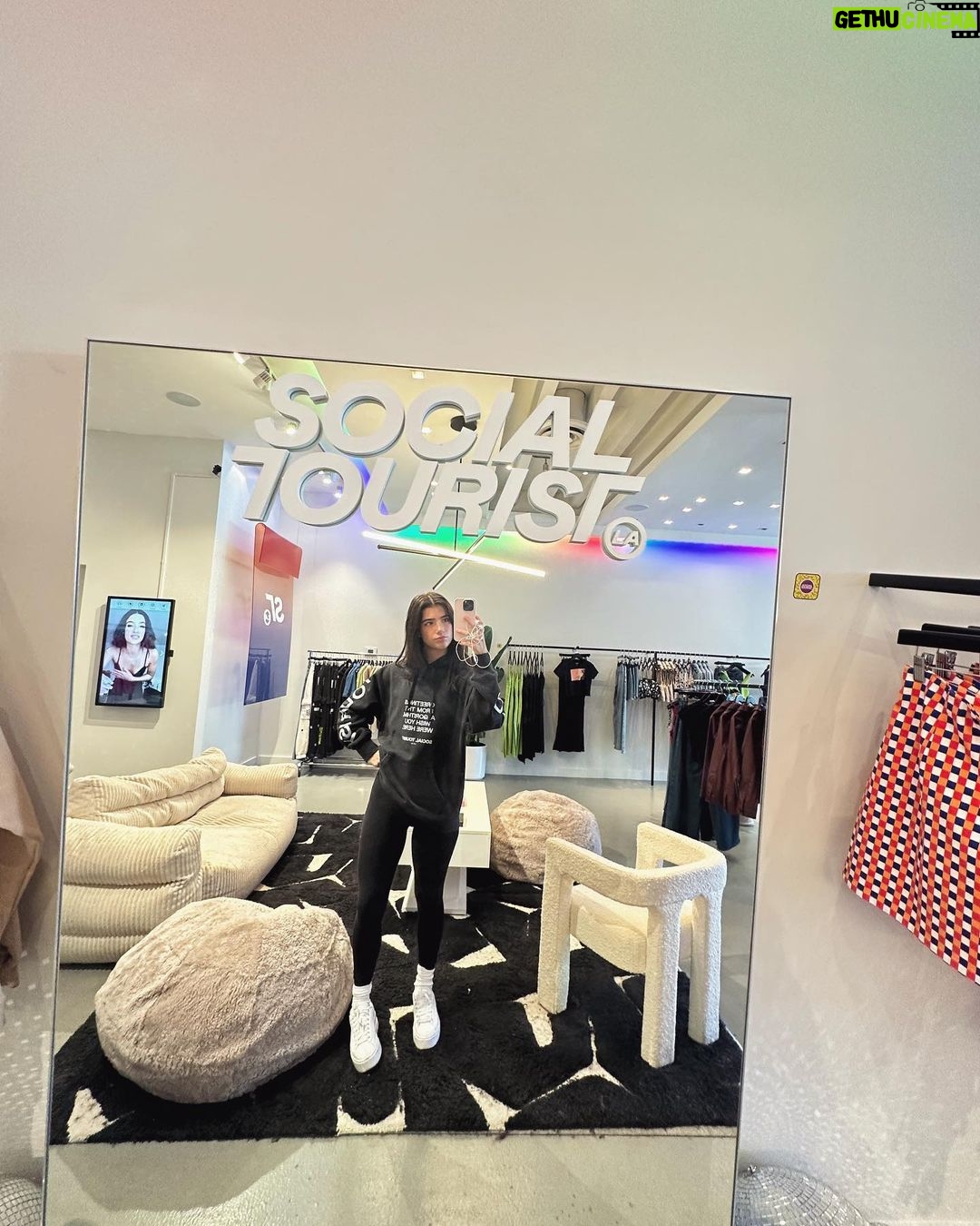 Charli D'Amelio Instagram - make sure to stop by the @socialtourist pop up store at 8406 melrose ave!! not only is it perfect for taking the most adorable photos but you can also shop social tourist and find our favs from the latest drops!! Social Tourist