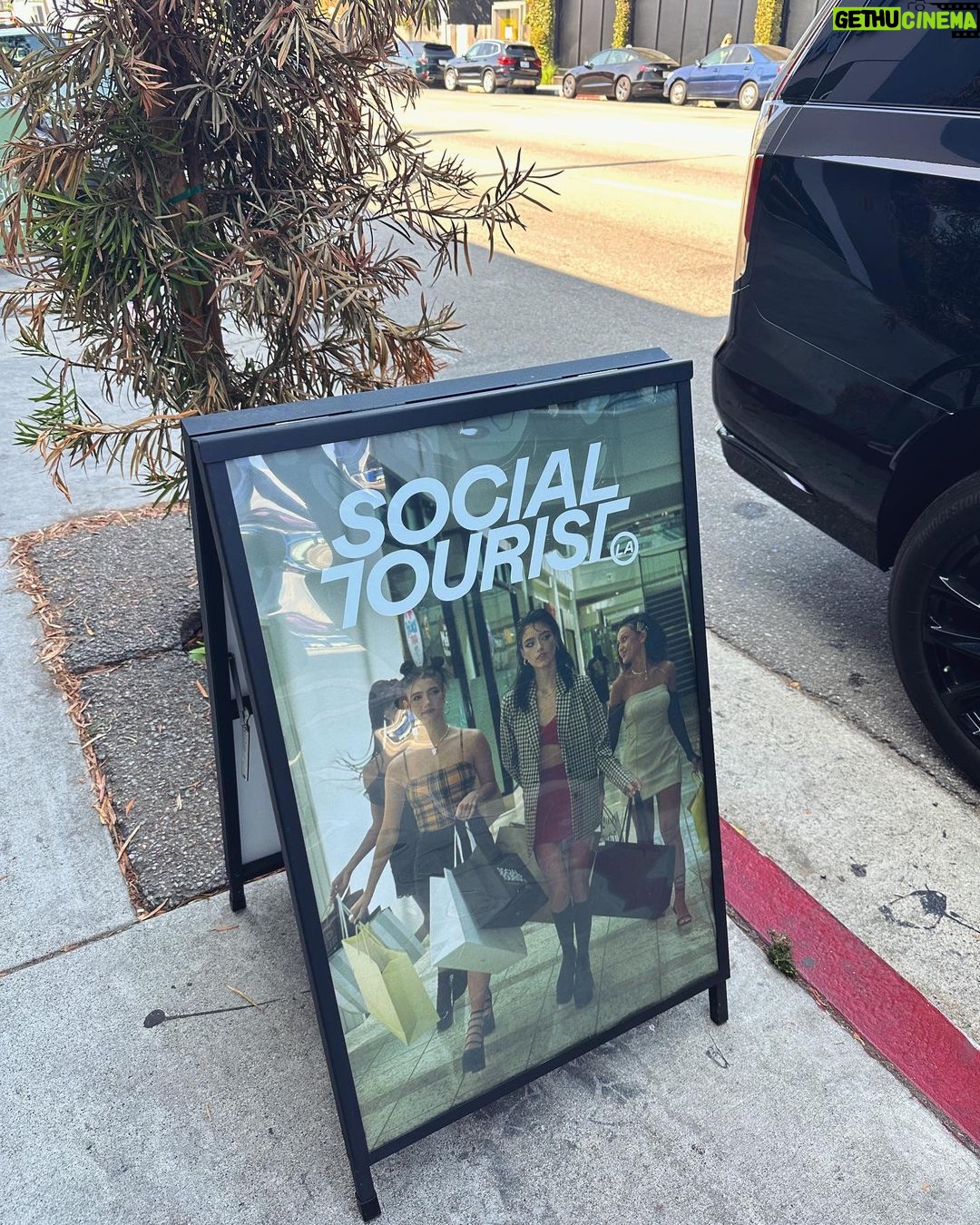 Charli D'Amelio Instagram - make sure to stop by the @socialtourist pop up store at 8406 melrose ave!! not only is it perfect for taking the most adorable photos but you can also shop social tourist and find our favs from the latest drops!! Social Tourist