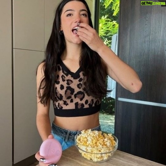 Charli D'Amelio Instagram - national popcorn day is today go to @walmart and shop @behappysnacksco or else you’re weird!