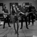 Chrissie Hynde Instagram - Hey look everybody! Here's the first ever photo of The Will Travel Band. Are we ugly enough to be a veritable rock band? Of-course we are! Don't insult my intelligence OR my sense of style by questioning it for even one minute. . That's me in the middle in the sad 70's looking leopard print jeans. To my left is bass player Dan Logan (looking like he dearly wishes he was anywhere else), over my shoulder you can just about see drummer Kris Sonne, and then Ollie McClaren with the cool looking guitar, and lastly to the far right, Sean Reid, our keyboardist. I know what you're thinking, " Fire the stylist" . Well, we might not be welcomed on the catwalk, but believe me, no combination of models from here to Paris can even dream of sounding as awesome as we do. So there. Now all we have to do is find a dive that will let us use their stage. Any takers? See ya there then...............xch. #chrissiehynde
