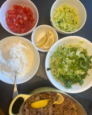 Chrissie Swan Instagram - I bang on about my homemade lamb shoulder souvlakis enough for it to warrant a space on this damned grid. I finally paid attention to what I actually *do* with this and you can not mess it up. I put this in the oven yesterday at 8.30am before I went to work and by the time I came home around 5ish the house smelled like roast lamb shoulder lovin’. I don’t know about slow cookers though - I’m an oven/cast iron pot gal. Also this freezes great. Sometimes I do two at once in 2 pots so I have a whole one ready to go - I just reheat the frozen one (once defrosted) in a hot fry pan. I shred it first so it’s good to go. Feeds a lot and you’ll eat whatever is there, trust me. 

HERE’S THE DRILL:
1. Buy about a 2kg lamb shoulder bone-in from the butcher or supermarket. Both are great. 
2. Put it in a cast iron pot with a lid with 2 cups of water, sprigs of rosemary and a whole bulb of garlic with the tip cut off. Whack the top in too. It doesn’t matter when it’s cooking for so long. 
3. Put it in the oven on 120 degrees for 8 hours or so. Time totally flexible. But minimum 8 hours. Can go longer. 
4. Pull the bones out (they’ll come out easily and clean) then drain off most of the liquid around it.
5. Have at it with 2 forks and shred the hell out of it. Pop the roasted garlic cloves out of their little paper clothes and strip what’s left of the rosemary - mix it all in. 
6. Add salt and fresh lemon juice.
OTHER BITS AND BOBS:
Natural yoghurt with loads of garlic (that’s the tzatziki bit)
Finely chopped Lebanese cucumber, tomato, lettuce and red onion.
Flatbreads (I like the ones from Coles in the fancy bakery section but any pita or wrap will do - they’ve gotta be flexible though cos you’re wrapping these babies).

WHAT TO DO NEXT:
Warm your flatbread - I do it on the open flame of my cooker (thanks for the tip all those years ago @elizabethwilmott ) but microwave works ok too!
Spread tzatziki, pile on salad stuff and juicy lamb.
Roll into a souvlaki.
Scoff.