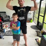 Christopher Lindsey Instagram - Mean-mugging with the meanest of mugs #troyboy! Peep the kingdom collapse shirt! I heard the new single “Anything”, and I’m loving it! Go check out @kingdomcollapse! #Stronghold #bodyguardboytroy #messiahofthebackbreaker #dadlife