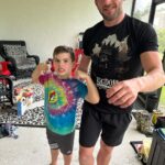 Christopher Lindsey Instagram - Mean-mugging with the meanest of mugs #troyboy! Peep the kingdom collapse shirt! I heard the new single “Anything”, and I’m loving it! Go check out @kingdomcollapse! #Stronghold #bodyguardboytroy #messiahofthebackbreaker #dadlife