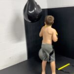 Christopher Lindsey Instagram - #Troyboy training for any and every thing!#Spiderboytroy #stronghold #family #dadlife #love #luckyguy @fyziogymrevolution #thepuncher