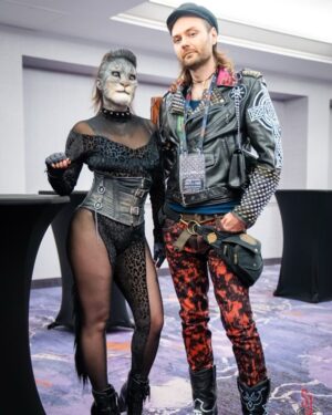 Cig Neutron Instagram - @rannieaugogo and I had the most incredible time at @theofficialdomcon I have such a deep respect for Dommes and the work that they do. Thank you so much @theofficialporcelainmidnight for inviting us, showing us around, and sharing your wisdom with us. Check out episode 116 of Spewtron where I interview Mistress Porcelain. My amazing jacket by @battle.jacket.bill if anyone knows the wonderful photographers IG please tag. #dom #domcon #domconla #battlejacket #cat #pet
