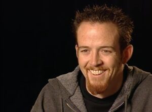 Dave Farrell Instagram - Hybrid Theory turns 22! As a 22 year-old, our oldest child (with any luck) would be finishing college this year, which is almost the exact time period in our lives when we were writing, recording, and then touring the album. In our early twenties there was nothing we liked better than a fun prank, and the end of a tour always provided a perfect opportunity. On the last show of one particular tour, the band @deadsy had a stage design that had always reminded me of an astroturf miniature golf course. I, having just taken up the game of golf, and Mike, always willing to participate in shenanigans, thought it might be fun to grab a ball and some clubs and “play through” the middle of Deadsy’s set. In the last moments building up to us “teeing off” onto their stage, Mike decided to craft a golf flag out of stage materials and gaff tape. In a matter of minutes, Mike put his art skills to work and built what I remember as the largest golf flag I’d ever seen. It seemed ridiculously large, but somehow ended up working perfectly with the size of the stage. It was a wonderful time that marked the beginnings of great things to come for Linkin Park’s future, and mediocre to average things to come for my golf game 😂. As a side note, I think most would be happy to know that my sartorial choices have slightly improved (I hope) when it comes to my choice of “on course attire!” Added a fun pic from this year’s Dunhill Links Championship with my pro teammate Russell Chrystie (russchrystie) - @phoenixlp