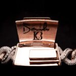 Davido Instagram - Davido’s bespoke pendant, dedicated to the success of his new album ‘Timeless’. A timeless ‘hourglass’ design, crafted with meticulous detail and hand selected diamonds. A moving hourglass, enclosed with diamond dust. A 350ct diamond pendant, weighing 1.5kg. Crafted with meticulous attention to detail. This exquisite pendant features hand-picked diamonds, constructed with a 1 carat pear diamond above the pendant. 4 - 0.5ct pear diamonds in the centre. A 30 pointer boarder for ‘30 Billion Gang’, as well as a 30 pointer boarder around the hourlgass. ‘30BG’ across the bespoke cuban chain. ‘30BG’ Baguette cut display. Designed in-house by our Local Kettle Brothers jewellery specialist team Cole, Emmanuel and Ethan. The "Timeless" pendant is a breathtaking masterpiece designed exclusively for Davido. A true embodiment of Davido’s unique style, the "Timeless" pendant is a symbol of inspiration, creativity, and enduring beauty that will adorn the wearer for generations to come.
