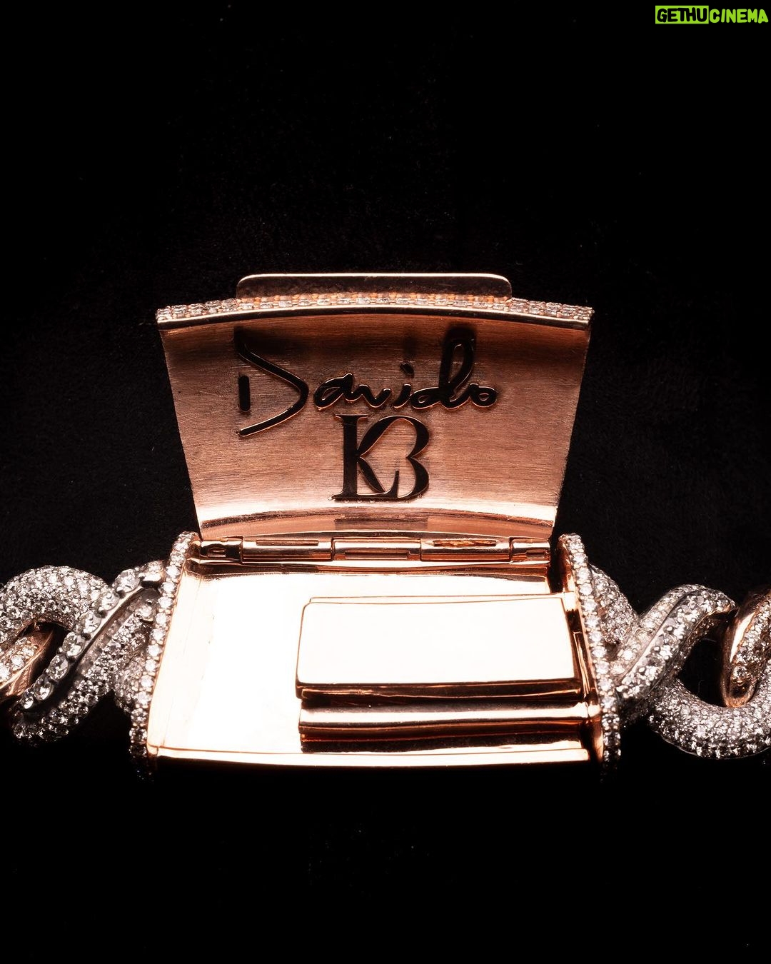 Davido Instagram - Davido’s bespoke pendant, dedicated to the success of his new album ‘Timeless’. A timeless ‘hourglass’ design, crafted with meticulous detail and hand selected diamonds. A moving hourglass, enclosed with diamond dust. A 350ct diamond pendant, weighing 1.5kg. Crafted with meticulous attention to detail. This exquisite pendant features hand-picked diamonds, constructed with a 1 carat pear diamond above the pendant. 4 - 0.5ct pear diamonds in the centre. A 30 pointer boarder for ‘30 Billion Gang’, as well as a 30 pointer boarder around the hourlgass. ‘30BG’ across the bespoke cuban chain. ‘30BG’ Baguette cut display. Designed in-house by our Local Kettle Brothers jewellery specialist team Cole, Emmanuel and Ethan. The "Timeless" pendant is a breathtaking masterpiece designed exclusively for Davido. A true embodiment of Davido’s unique style, the "Timeless" pendant is a symbol of inspiration, creativity, and enduring beauty that will adorn the wearer for generations to come.