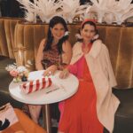 Dawn McCoy Instagram - Cheers to our dear - and talented - friend, @christopherkennedyinc on his newest design project launch, @canopywinelounge, in downtown Palm Springs. A beautifully designed space that both celebrates the desert you’re in and also makes you feel like you’re being transported to an exotic destination - Canopy is sure to be the newest hot spot for Palm Springs locals and tourists alike. From the decadent, velvet chartreuse booths to the tall, white paper trees and vegetation, you cozy up in there, thinking to yourself, “I’ve never been anywhere quite like THIS before.” And how spectacular is that? I’m also so proud to toot another friend’s horn who is involved in this opening - my wonderful friend, @lowiemoore @lawrencemooreassociates is Canopy’s PR. So you know who you need to contact if you’d like to cover it for press. I loved it so much that I’m not even slightly exaggerating when I say that I can’t wait to get back. Sure to be new favorite place to meet friends and business associates (and work solo while enjoying a glass of wine), my favorite wine I tried was their Justice Cabernet. How perfect is that? It’s a sign if you ask me.🍷 @kellygolightly and I - as well as a slew of other friends (as you can see) had the loveliest time and I can’t think of a better way to welcome in the holidays than hugging friends while celebrating other friends’ successes. ☺️🎄❤️ Kelly and I even sported her @kellygolightly x @bethladdcollections swan earrings and clutches and our @jouercosmetics x @lovingwayfoundation lip kits.💋 My ensemble: @trinaturk - styled by @denise_in_socal My shoes: @seychellesshoes at @trinaturk @shopelpaseo Palm Springs, California