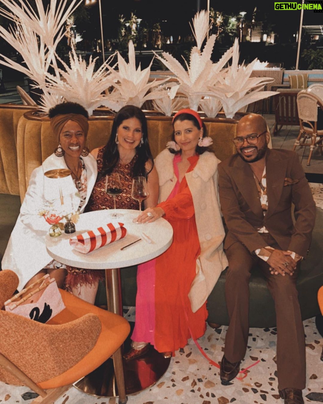Dawn McCoy Instagram - Cheers to our dear - and talented - friend, @christopherkennedyinc on his newest design project launch, @canopywinelounge, in downtown Palm Springs. A beautifully designed space that both celebrates the desert you’re in and also makes you feel like you’re being transported to an exotic destination - Canopy is sure to be the newest hot spot for Palm Springs locals and tourists alike. From the decadent, velvet chartreuse booths to the tall, white paper trees and vegetation, you cozy up in there, thinking to yourself, “I’ve never been anywhere quite like THIS before.” And how spectacular is that? I’m also so proud to toot another friend’s horn who is involved in this opening - my wonderful friend, @lowiemoore @lawrencemooreassociates is Canopy’s PR. So you know who you need to contact if you’d like to cover it for press. I loved it so much that I’m not even slightly exaggerating when I say that I can’t wait to get back. Sure to be new favorite place to meet friends and business associates (and work solo while enjoying a glass of wine), my favorite wine I tried was their Justice Cabernet. How perfect is that? It’s a sign if you ask me.🍷 @kellygolightly and I - as well as a slew of other friends (as you can see) had the loveliest time and I can’t think of a better way to welcome in the holidays than hugging friends while celebrating other friends’ successes. ☺️🎄❤️ Kelly and I even sported her @kellygolightly x @bethladdcollections swan earrings and clutches and our @jouercosmetics x @lovingwayfoundation lip kits.💋 My ensemble: @trinaturk - styled by @denise_in_socal My shoes: @seychellesshoes at @trinaturk @shopelpaseo Palm Springs, California