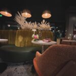 Dawn McCoy Instagram - Cheers to our dear - and talented - friend, @christopherkennedyinc on his newest design project launch, @canopywinelounge, in downtown Palm Springs. A beautifully designed space that both celebrates the desert you’re in and also makes you feel like you’re being transported to an exotic destination - Canopy is sure to be the newest hot spot for Palm Springs locals and tourists alike. From the decadent, velvet chartreuse booths to the tall, white paper trees and vegetation, you cozy up in there, thinking to yourself, “I’ve never been anywhere quite like THIS before.” And how spectacular is that? I’m also so proud to toot another friend’s horn who is involved in this opening - my wonderful friend, @lowiemoore @lawrencemooreassociates is Canopy’s PR. So you know who you need to contact if you’d like to cover it for press. I loved it so much that I’m not even slightly exaggerating when I say that I can’t wait to get back. Sure to be new favorite place to meet friends and business associates (and work solo while enjoying a glass of wine), my favorite wine I tried was their Justice Cabernet. How perfect is that? It’s a sign if you ask me.🍷 @kellygolightly and I - as well as a slew of other friends (as you can see) had the loveliest time and I can’t think of a better way to welcome in the holidays than hugging friends while celebrating other friends’ successes. ☺️🎄❤️ Kelly and I even sported her @kellygolightly x @bethladdcollections swan earrings and clutches and our @jouercosmetics x @lovingwayfoundation lip kits.💋 My ensemble: @trinaturk - styled by @denise_in_socal My shoes: @seychellesshoes at @trinaturk @shopelpaseo Palm Springs, California