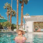 Dawn McCoy Instagram - Sunset and sunrise swims every single day are simply my kind of heaven. This house, @splashofink_ps - pictured here - is the kind of house that makes you fall in love with Palm Springs.🌴 With color galore - and the consummate indoor-outdoor living space - we spent the bulk of our time in the pool or hot tub. Looking at my calendar the next few months, there’s a lot of Palm Springs penciled in there - for work, for Modernism Week and for some other big stuff. And thinking about all that’s up ahead could be downright daunting, but when I think of those soaks and swims with my son? I just can’t wait to get back.🩵 House hosted by @splashofink_ps managed by @wanderluxe_vacation_rentals Branded & designed by @johnpatrickpalmsprings 📷: @andrewcabral_photography Swimsuit: @showmeyourmumu Hat: @trinaturk - styled by @denise_in_socal Palm Springs, California