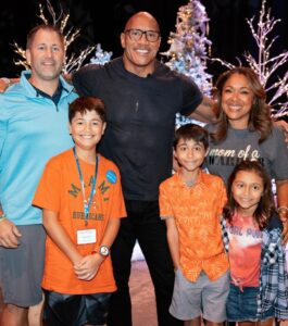 Dwayne Johnson Instagram - Already more muscles than me - just another day in the life of Peyton Frederick from @makeawishamerica. 😉💪🏾 He’s 10 and he’s awesome! Peyton’s wish was to meet me. And man this kid lights up the room with his awesome personality!! Loves playing sports and already establishing those building blocks of discipline of the hardest workers in the room. He was proud to let me know he had gotten his morning workout in before we met 😄👏🏾💪🏾 We had a lot of laughs together and I was very impressed with this kid. He could go on to become a pro athlete one day and I just hope he gives me free tickets 🎟️ 🤣 A lot of negative noise out there in the world, but there’s also a lot of amazing positive things too, and Peyton is one of them! #MakeAWishDay #21Kids #BestDayEver