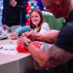 Dwayne Johnson Instagram – I turn into a big emotional dinosaur 🦖🥹 when I meet these little girls who look at me like this – because it reminds me of my three daughters that I’ve been blessed with. 

This is Maya Walter from @makeawishamerica. 

She’s 11 and she’s awesome! 

This heart stealer was such a joy to spend time with. So cool, calm, poised and beautiful energy and demeanor. 

BUT, don’t get it twisted, she’s also a bad ass and a real fighter too! Don’t let that smile fool ya 🥰😉

We hung out. 
I signed her cast (crazy story about her break 👀) 
She gave me awesome bracelets – representing lyrics from my rap song “FACE OFF” 

💥It’s about drive, it’s about power 💥 

Lots of toxicity out there in the world, but if you look past that – there’s much more positivity and hope – and Maya is a shining example of that. 

#MakeAWishDay
#21Kids 
#BestDayEver 
#TeamGirlDad