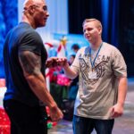 Dwayne Johnson Instagram - This is Joshua Williams from @makeawishamerica and he’s a fighter- and bad ass!! He’s 16 and awesome! Joshua’s wish was to meet me. Loved meeting this kid and he’s got fighting in his DNA. All these kids have gone thru so much struggle, that they all become fighters in their own incredible way. Really enjoyed my time with Joshua and great to see him training hard and being the inspiring example that he is to everyone! Lots of negativity out there in the world, but there’s also A LOT of hope and positivity too - and Joshua is a reflection of that hope and good energy. #MakeAWishDay #21Kids #BestDayEver
