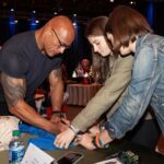 Dwayne Johnson Instagram – This is Grace Eline from @makeawishamerica 
She’s 16 and she’s awesome! 

Grace’s wish was to meet me. 
And I was lucky to meet her! 

Incredibly selfless young woman who is running her own organization that helps kids battling cancer – with support, love, positivity & KINDNESS. Amazing girl. 

I told her when I was 16 the only “running” I was doing was from the cops 😂👮🏽‍♀️🙋🏽‍♂️🤦🏽‍♂️

There’s a lot of good kids doing amazing things out there in the world, and Grace is one of them. 

#MakeAWishDay 
#21Kids
#BestDayEver