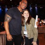 Dwayne Johnson Instagram - This is Grace Eline from @makeawishamerica She’s 16 and she’s awesome! Grace’s wish was to meet me. And I was lucky to meet her! Incredibly selfless young woman who is running her own organization that helps kids battling cancer - with support, love, positivity & KINDNESS. Amazing girl. I told her when I was 16 the only “running” I was doing was from the cops 😂👮🏽‍♀️🙋🏽‍♂️🤦🏽‍♂️ There’s a lot of good kids doing amazing things out there in the world, and Grace is one of them. #MakeAWishDay #21Kids #BestDayEver