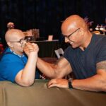 Dwayne Johnson Instagram – This is Adelaide Bomberger from @makeawishamerica. 

She’s 17 and awesome. 

Adelaide’s wish was to meet me, beat me at arm wrestling, and do our VERY special bald head touch handshake – so I can have the honor of joining her “bad ass team bald club”. 

She succeeded at all three 3️⃣ ☑️ 🥰 

Amazing kid. 
I’m lucky to meet her. 

Stay strong Adelaide — you inspire everyone around you, including me. 

A lot of positive and good stuff still happening around the world, and Adelaide is one of them. 

#MakeAWishDay
#21Kids 
#BestDayEver