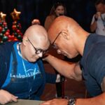 Dwayne Johnson Instagram – This is Adelaide Bomberger from @makeawishamerica. 

She’s 17 and awesome. 

Adelaide’s wish was to meet me, beat me at arm wrestling, and do our VERY special bald head touch handshake – so I can have the honor of joining her “bad ass team bald club”. 

She succeeded at all three 3️⃣ ☑️ 🥰 

Amazing kid. 
I’m lucky to meet her. 

Stay strong Adelaide — you inspire everyone around you, including me. 

A lot of positive and good stuff still happening around the world, and Adelaide is one of them. 

#MakeAWishDay
#21Kids 
#BestDayEver