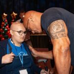 Dwayne Johnson Instagram – This is Adelaide Bomberger from @makeawishamerica. 

She’s 17 and awesome. 

Adelaide’s wish was to meet me, beat me at arm wrestling, and do our VERY special bald head touch handshake – so I can have the honor of joining her “bad ass team bald club”. 

She succeeded at all three 3️⃣ ☑️ 🥰 

Amazing kid. 
I’m lucky to meet her. 

Stay strong Adelaide — you inspire everyone around you, including me. 

A lot of positive and good stuff still happening around the world, and Adelaide is one of them. 

#MakeAWishDay
#21Kids 
#BestDayEver
