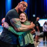 Dwayne Johnson Instagram – This is Grace Eline from @makeawishamerica 
She’s 16 and she’s awesome! 

Grace’s wish was to meet me. 
And I was lucky to meet her! 

Incredibly selfless young woman who is running her own organization that helps kids battling cancer – with support, love, positivity & KINDNESS. Amazing girl. 

I told her when I was 16 the only “running” I was doing was from the cops 😂👮🏽‍♀️🙋🏽‍♂️🤦🏽‍♂️

There’s a lot of good kids doing amazing things out there in the world, and Grace is one of them. 

#MakeAWishDay 
#21Kids
#BestDayEver