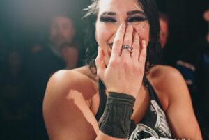 Dwayne Johnson Instagram - She wears black.
I love black. 
She’s a bad ass. 
And I got famous for wearing a fanny pack. 
We had fun f*cking around backstage 😈🥃

Love, appreciate and respect you champ @rhearipley_wwe - thanks for trusting me with your title, keep kickin’ ass and raising the bar 🖤💪🏾

Big shout to @cathykelley for being a total pro and having fun 🎤 👊🏾

#peopleschamp ✊🏾

📸 @flanneryunderwood @wwe