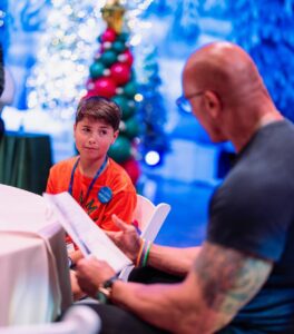 Dwayne Johnson Instagram - Already more muscles than me - just another day in the life of Peyton Frederick from @makeawishamerica. 😉💪🏾 He’s 10 and he’s awesome! Peyton’s wish was to meet me. And man this kid lights up the room with his awesome personality!! Loves playing sports and already establishing those building blocks of discipline of the hardest workers in the room. He was proud to let me know he had gotten his morning workout in before we met 😄👏🏾💪🏾 We had a lot of laughs together and I was very impressed with this kid. He could go on to become a pro athlete one day and I just hope he gives me free tickets 🎟️ 🤣 A lot of negative noise out there in the world, but there’s also a lot of amazing positive things too, and Peyton is one of them! #MakeAWishDay #21Kids #BestDayEver