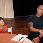 Dwayne Johnson Instagram – Already more muscles than me – just another day in the life of Peyton Frederick from @makeawishamerica. 😉💪🏾

He’s 10 and he’s awesome! 

Peyton’s wish was to meet me. 

And man this kid lights up the room with his awesome personality!! 

Loves playing sports and already establishing those building blocks of discipline of the hardest workers in the room. 

He was proud to let me know he had gotten his morning workout in before we met 😄👏🏾💪🏾

We had a lot of laughs together and I was very impressed with this kid. He could go on to become a pro athlete one day and I just hope he gives me free tickets 🎟️ 🤣 

A lot of negative noise out there in the world, but there’s also a lot of amazing positive things too, and Peyton is one of them! 

#MakeAWishDay
#21Kids 
#BestDayEver