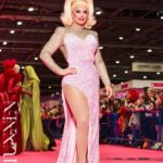 Ella Vaday Instagram - @rupaulsdragcon 2024 was an absolute blast! Always love it as it gives you a chance to meet so many people that support you as well as hundreds of fellow drag racers from across the globe, there’s nothing quite like it! Thankyou all for coming to see me, I personally have a fear of my birthday for fear no one will show up, so imagine my anxiety for dragcon each time!!! Early mornings, and long days in full glam and heels, went so quickly thanks to the lovely people that came to see me. Massive thanks too to my lovely BF and @vivianbambam for helping run my booth, anyone that visited will agree they are THE BEST! ❤️ Dress @the_drag_room Hair @venus.nv , wig base @howsyourheadwigs Pic 1&2 @stunnin.mag Merch pics by @owenjamesvincent Video @laurenladuca