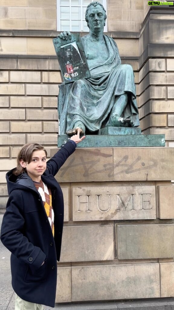 Ethan Thomas Jung Instagram - Touching Hume’s toe for luck 🍀 Just came across this memory from earlier in the year. #latergram #scotland #hume #luck #edinburg #royalmile Edinburgh, Scotland