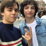 Finn Wolfhard Instagram - New Meet on the STREET LEGAL podcast with @tryingosling complete with his graphic but accurate rendition of the @lacklusterpod backstory and my sudden realization that @headgum may be generating the space time continuum itself as Posted @withregram • @lacklusterpod from @tryingosling : A couple of years ago I was eating butternut squash soup on a patio with my brother and said “I’m telling you Bogus Journey is better- oh shit, I think that’s Finn Wolfhard.” I was right. Bogus Journey is better. Also it was Finn Wolfhard. I asked him if he liked Jake and Amir even though I knew the answer was yes and we talked for a few minutes about our favourite movies and comedians. Then he had to go to a record signing and I had to get back to my butternut squash soup so we parted ways. Cut to a year later. I’m eating lunch my first day on set of a movie and I don’t really know anyone yet. Finn sits down across from me and says “Hey man, I’m Finn. Do I know you?” “We actually met very briefly in Toront-“ “Oh shit, you’re the Jake and Amir kid!” We picked up our conversation where it left off and kind of never stopped talking. Another year-ish later we have a show together on Jake and Amir’s podcast network and it’s us still talking about our favourite movies and comedians. It’s a really surreal and lovely and bizarre full circle thing that I’m super grateful for. Two guys sitting at their desks are responsible for my entire sense of humour and half of my friendships. I’m really grateful for that too. “Oh shit, you’re the Jake and Amir kid!” I was the Jake and Amir kid. And so was Finn. We both still are. Lackluster Video 02 comes out TODAY. Special Guest: Amir Valerie Blumenfeld himself. 💙💛 The Singularity
