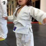 Frank Camacho Instagram - Stepping onto the mat with the biggest little smile, my 2-year-old girl began her first #Purebred Tiny Smashers Jiujitsu class today and my heart is doing somersaults! 🌟🥋✨ It’s more than just cute gi’s and playful tumbles; it’s about shaping her young mind with respect, teamwork, physical health, and discipline. 💪🧠 This is where she’ll learn to fall and rise, and embrace the joy of the journey. If you’re ready for your little ones to start a path filled with fun, fitness, and lifelong lessons, send us a message! 📩👶🤼‍♂️ #ProudDad #FirstGi #JiujitsuKids #sharejiujitsu #purebredjiujitsu Purebred BJJ Guam