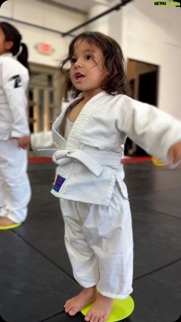 Frank Camacho Instagram - Stepping onto the mat with the biggest little smile, my 2-year-old girl began her first #Purebred Tiny Smashers Jiujitsu class today and my heart is doing somersaults! 🌟🥋✨ It’s more than just cute gi’s and playful tumbles; it’s about shaping her young mind with respect, teamwork, physical health, and discipline. 💪🧠 This is where she’ll learn to fall and rise, and embrace the joy of the journey. If you’re ready for your little ones to start a path filled with fun, fitness, and lifelong lessons, send us a message! 📩👶🤼‍♂️ #ProudDad #FirstGi #JiujitsuKids #sharejiujitsu #purebredjiujitsu Purebred BJJ Guam