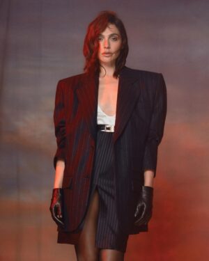 Gal Gadot Instagram - Thank you for having me @FlauntMagazine 
❤️🖤

Photographed by @GregSwalesArt
Styled by @KarlaWelchStylist wearing @TiffanyandCo
Written by @EAubrey_Writes
Hair: @DimitrisHair
Makeup: @TyronMachhausen
Nails: @Tracy_Clemens
Set Designer:@ItsIsaacAaron
Flaunt Film: @ShootChevyTyler