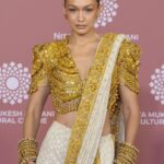 Gigi Hadid Instagram - The @nmacc.india Gala was a celebration of Indian craftsmanship, and its inspiration on fashion internationally, with the opening of the exhibit “India in Fashion: The Impact of Indian Dress and Textiles on the Fashionable Imagination,” curated by the iconic @hamishbowles! It was my honor and joy to showcase this masterpiece designed by @abujanisandeepkhosla 🙏 this Chikankari sari was made in the Lucknow region of India, and took a year to make; each woman who crafted it specializes in a different stitch 🤩 truly remarkable workmanship .. I’ll never forget it 💫 Mumbai - मुंबई