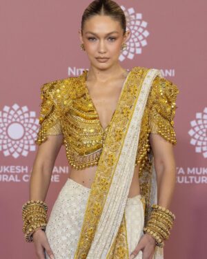 Gigi Hadid Instagram - The @nmacc.india Gala was a celebration of Indian craftsmanship, and its inspiration on fashion internationally, with the opening of the exhibit “India in Fashion: The Impact of Indian Dress and Textiles on the Fashionable Imagination,” curated by the iconic @hamishbowles! 
It was my honor and joy to showcase this masterpiece designed by @abujanisandeepkhosla 🙏  this Chikankari sari was made in the Lucknow region of India, and took a year to make; each woman who crafted it specializes in a different stitch 🤩 truly remarkable workmanship .. I’ll never forget it 💫