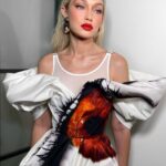 Gigi Hadid Instagram - Celebrated NIF last night in McQueen & some @maybelline favorites — the NEW (major) Falsies Surreal Mascara, Fit Me Foundation, and an oldie but a goodie- Color Blur in “Orange Ya Glad” ❤️‍🔥 (check out @patrickta’s tiktok for a silly GRW[Us]) x New York, New York