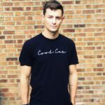 Giles Matthey Instagram - 🥶😼. Pretending to b cool by a wall. Love this T-shirt though. @drinkcoolcat @rocco_venneri .
