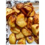 Ginnifer Goodwin Instagram - Dear @missjobaker, Here is my babbling recipe for #roastpotatoes. Slide 2. I prep my (often Yukon gold) #potatoes at least 24 hours before I want to cook them. I peel said potatoes and cut them into same-ish sized pieces. I do NOT parboil them. I generously salt the potatoes and STEAM them for as long as it takes me to drink a cup of tea, get sucked into a book, and go, “Oh no! The potatoes!” I bet this is a 15 minute experience? Then I take a skewer and rake that across a potato. Is there evidence of potato-ness on said skewer? If so, I move on to… Slide 3. Holding the lid firmly in place, I bang the potatoes about the steam basket. I then remove the lid and let the potato steam do it’s go-away thing. Slide 4. I line a baking sheet with a piece of parchment paper and spread the potatoes out so that they are not touching. I cover the whole thing in plastic wrap, because I haven’t found a better solution. I put the baking sheet in the freezer til whenever-in-the-future I need to roast potatoes. The freezer is the secret weapon. Slide 5. On another day when I’m hungry, I preheat the oven to 400F. I coat my roasting tin with a high-smoke-point oil — my fam prefers something animal-based — and I use only enough to make the whole bottom glassy and that’s IT. I stick the oily tin in the oven to warm up for 5-ish minutes. NOW I go get my potatoes out of the freezer. I put the tin on the stovetop, turn up the heat to medium (if the tin is stove-top safe) and dump the potatoes in the tin. I step back! They splatter! Can you see in the photo that I use such a small amount of oil that it’s ALMOST all soaked up by the potatoes? As quickly as possible, I flip them around with tongs in what oil is left. I pop the tin in the oven. I do not touch the potatoes again. Slide 1. I wish I could tell you how long I roast my potatoes. It could be 40 minutes? I just watch the color and I fiddle with the temperature so that they come out after everything else is ready to serve. They are effing crispy on the outside and effing fluffy on the inside. Lemme know if you give ‘em a try! P.S. I threw in a pic of my favorite platter, because… Digby.