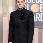 Haley Tju Instagram – @ChrisPerfetti at the Golden Globes 🖤🌸

Suit: @maisonmargiela 
Shirt: @blkdnm 
Shoes: @jb_rautureau 

Styled by @haleytju