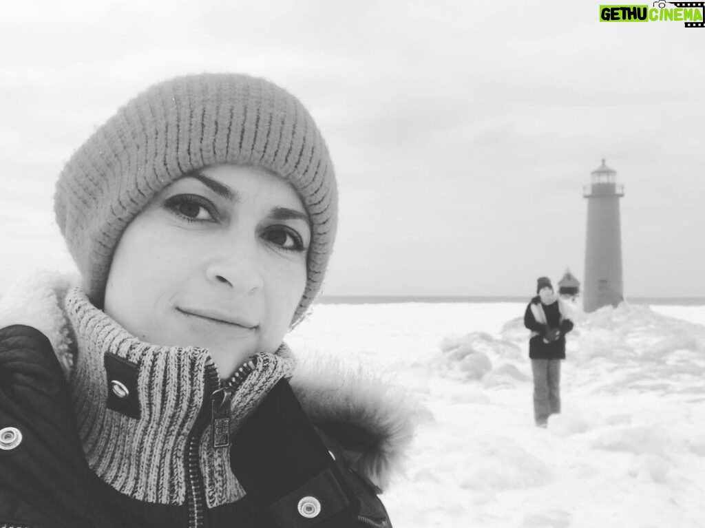 Halyna Hutchins Instagram - Scout hike with my director on the frozen pier. #michigan #filminglocation #frozenpier #winterfilming #scout #onlocation #setlife #cinematography #lighthouse Grand Haven Lighthouse and Pier