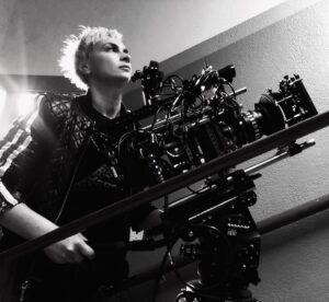 Halyna Hutchins Instagram - BTS. Archenemy. Photo credit to my amazing 2nd AC @amandapetrone who caught me in the moment. #cinematographer #cinematography #onset #cameraoperator #directorofphotography #panavision #panavisionofficial #arrialexamini #anamorphics #cameracrew #filming #behindthescenes