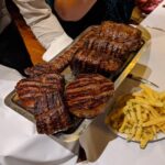 Henry Cavill Instagram - If you don't like the meats....look away now. I went out for a little more culture last night and found the best steak I've ever had!! Genuinely.... I don't need to post this, I just feel like I should. The steak in Argentina is absolutely incredible...... I had a 600 gram filet mignon and didn't slow down once throughout. That coupled with some mega good malbec, made it a dinner I will not forget! Then I got to meet the people responsible for the legendary hunk of meat in the kitchen of El Mirasol (that's the restaurant). This fella here clearly thinks I'm great. Couldn't cross my wrists for Heliotrope but maybe some Quen would give me the edge! #BuenosAires #Argentina #ElMirasol #Steak #TheWitcher