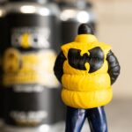 Inspectah Deck Instagram - “Bomb Atomically” DDH IPA is a collaboration effort between @ins_tagrams and Infamous @beer.tape , brewed and packaged by @killsboro #Brewing Company. Gushing with Nectarine, Pineapple, Passionfruit, and Peach, this #beer was double dry hopped with Nectaron, Strata and Motueka. Big mouth feel exploding with citrus and tropical fruit flavor. This limited release is available at our launch event today at the 60 Van Duzer tap room! Tickets available now. Big shout out to @fatohh and @shawnwigs on the art toys #craftbeer #wutang #wutangclan Kills Boro Brewing Company